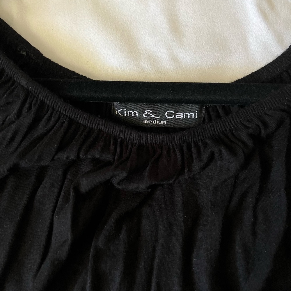 Black with tie at hips. Short sleeve   Only worn 1-2 times